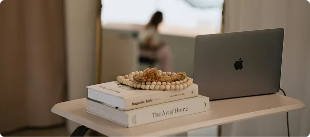 Laptop and books on a table
